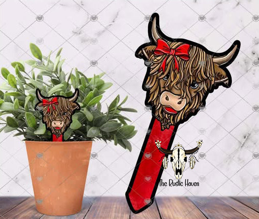 Cute highland cow with bow plant stake